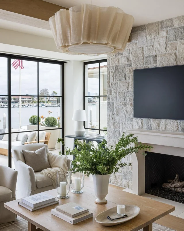 The heart of everyday life at #mgdxlido, the family room is a space designed for lounging, gathering, and soaking in the bayfront light. Soft textures, natural materials, and layers of warmth create the ultimate California retreat. #mindygayerdesign { Image by: @vlentine, Architect: @brandonarchitects, Builder: @longmanconstruction }